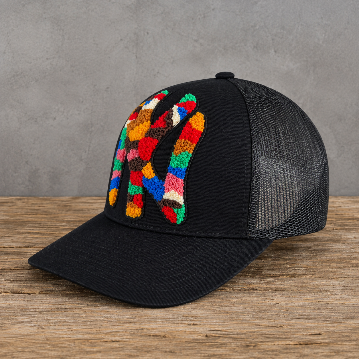 right angle The Onyx Collection Statement NY Chenille Hat with oversized multicolor chenille NY patch on black cap
