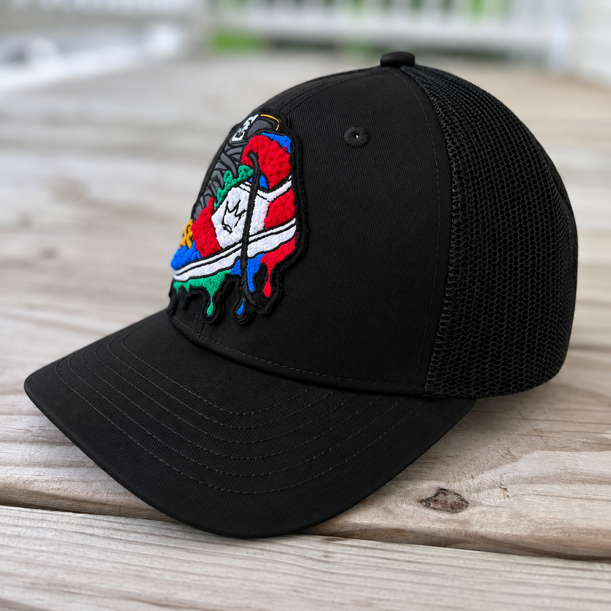 side view The Onyx Collection Chenille Rebel Sneaker black hat with handcrafted patchwork