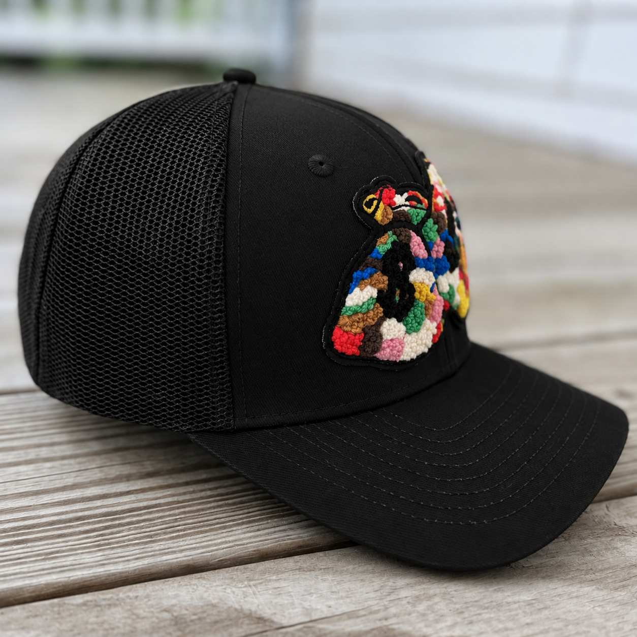 side view The Onyx Collection Chenille Money Bag Hat 