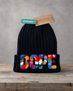 Black beanie featuring a handcrafted chenille DOPE patch