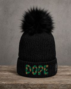 Chunky cable knit pom beanie featuring a handcrafted DOPE patch