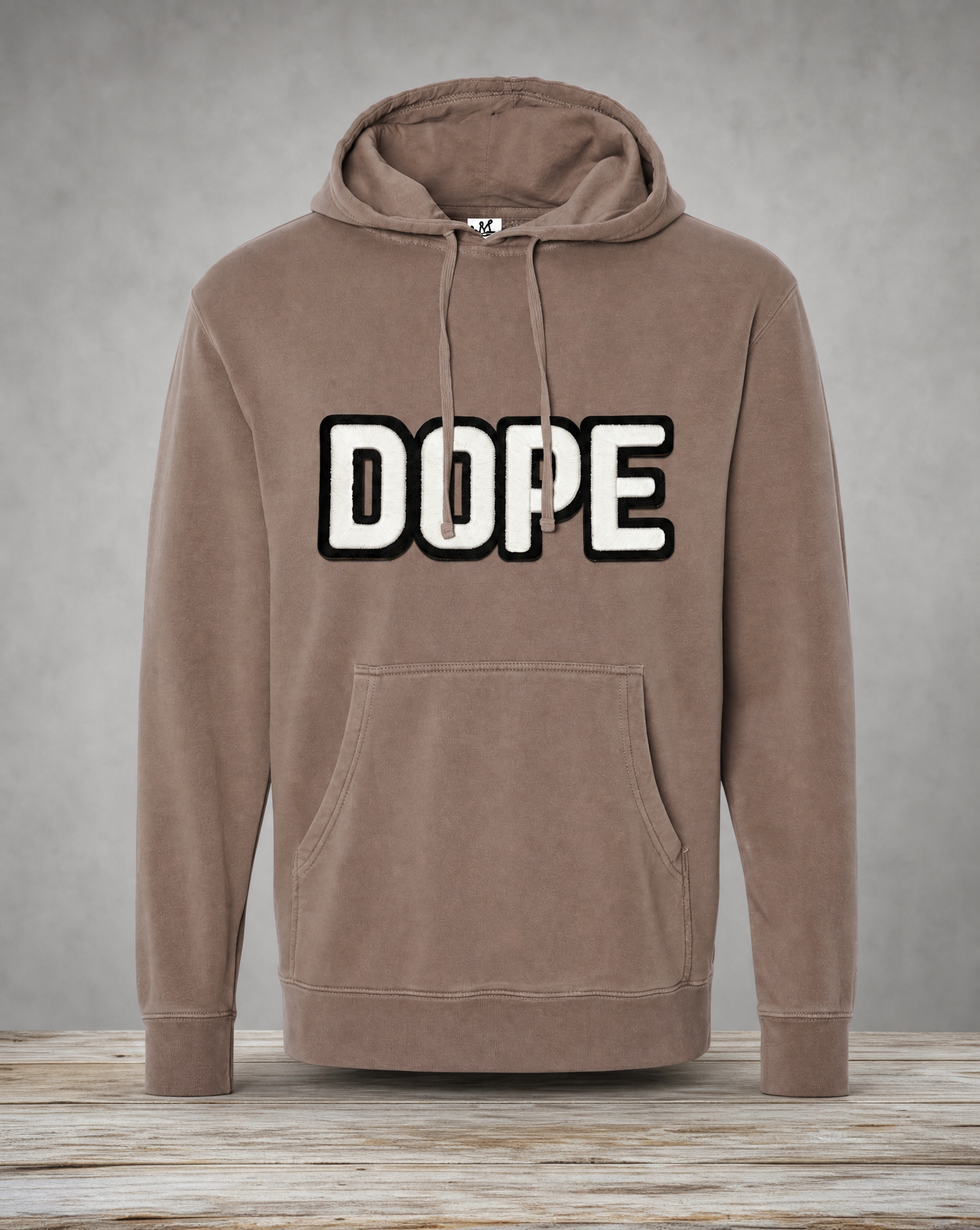 Brown hoodie featuring a handcrafted glow-in-the-dark DOPE patch