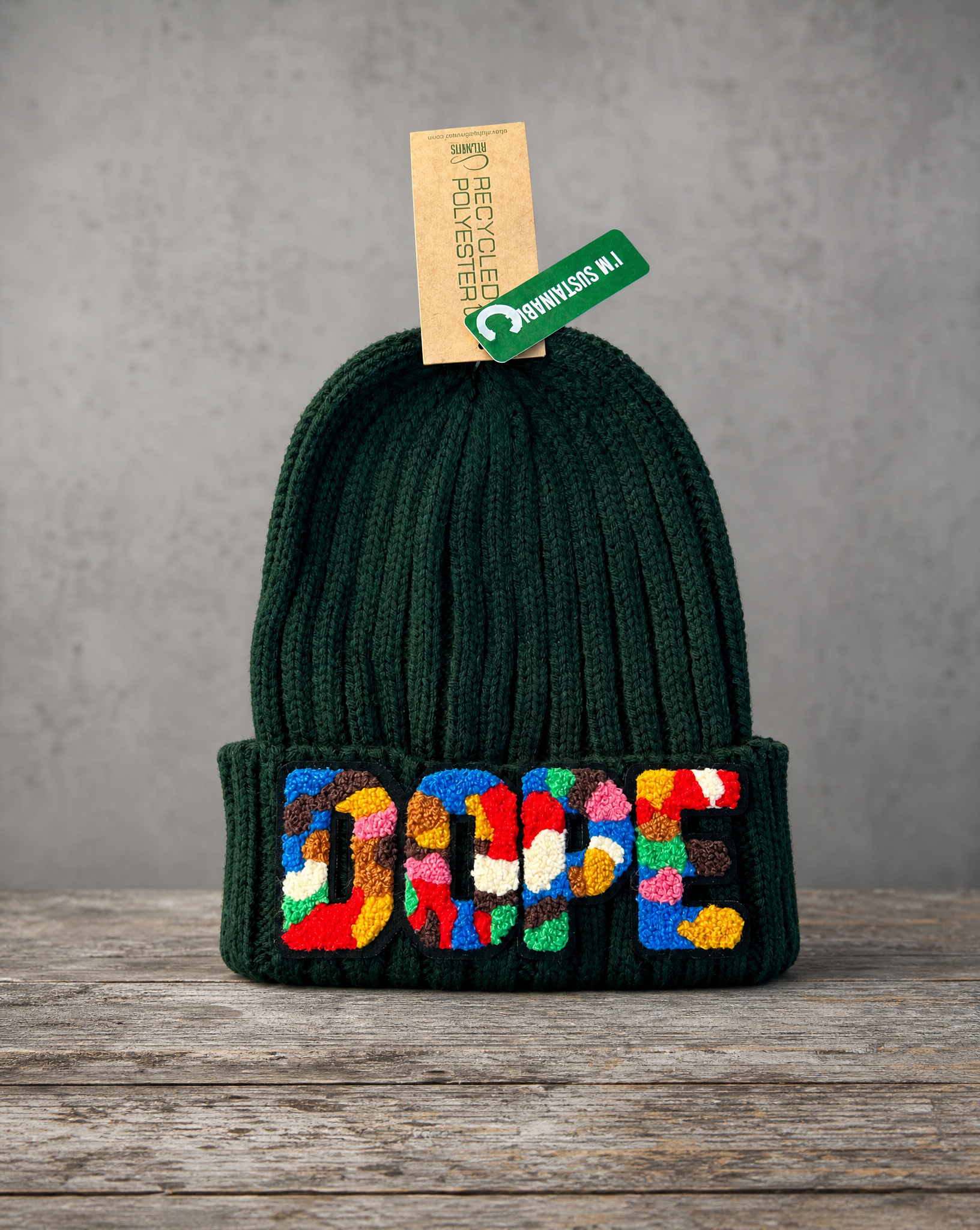 Sustainable knit beanie featuring a handcrafted chenille DOPE patch