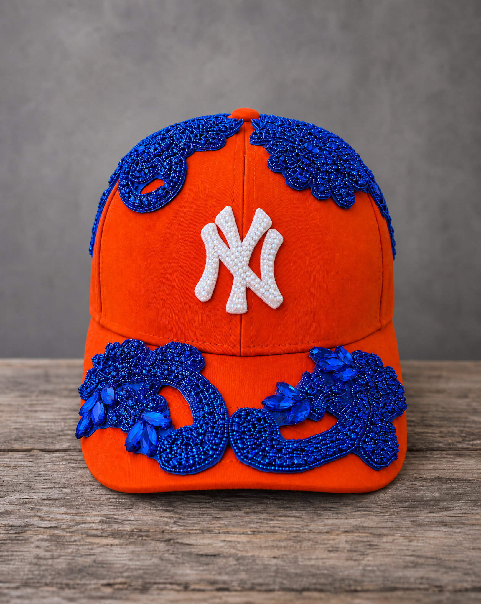 Blue Crystal Appliqué Orange New York Hat with hand-sewn blue crystal design