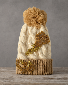 Gold crystal appliqué cable knit pom beanie with handcrafted crystal embellishments
