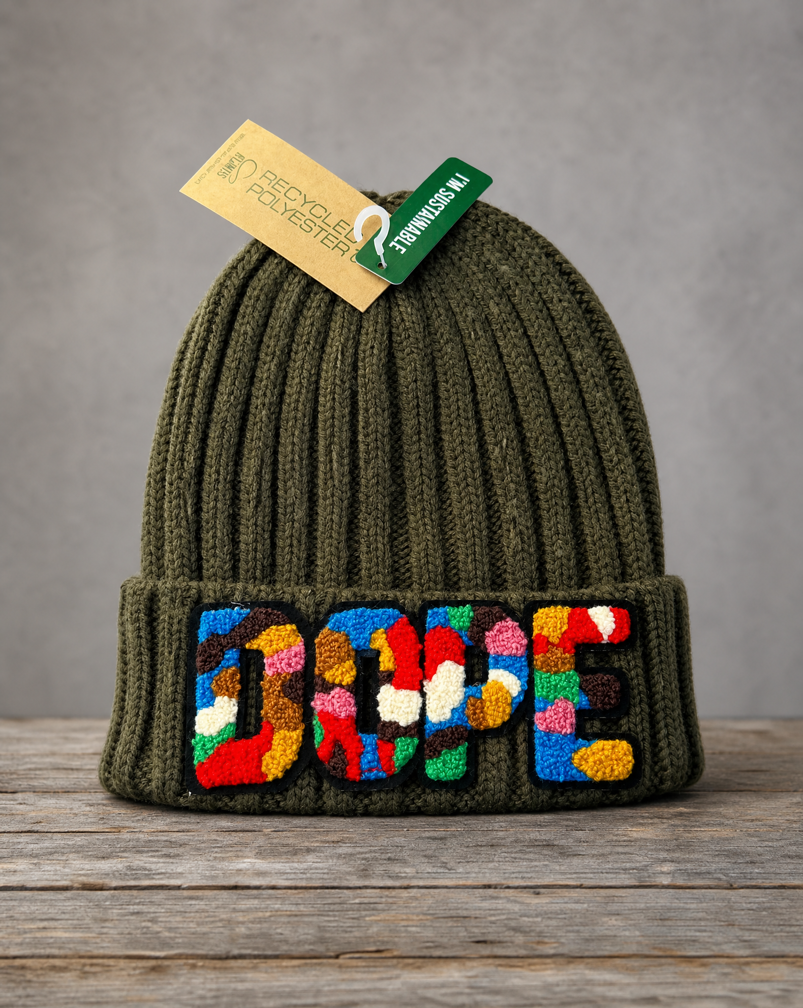 Olive Green cable knit beanie featuring a handcrafted chenille DOPE patch
