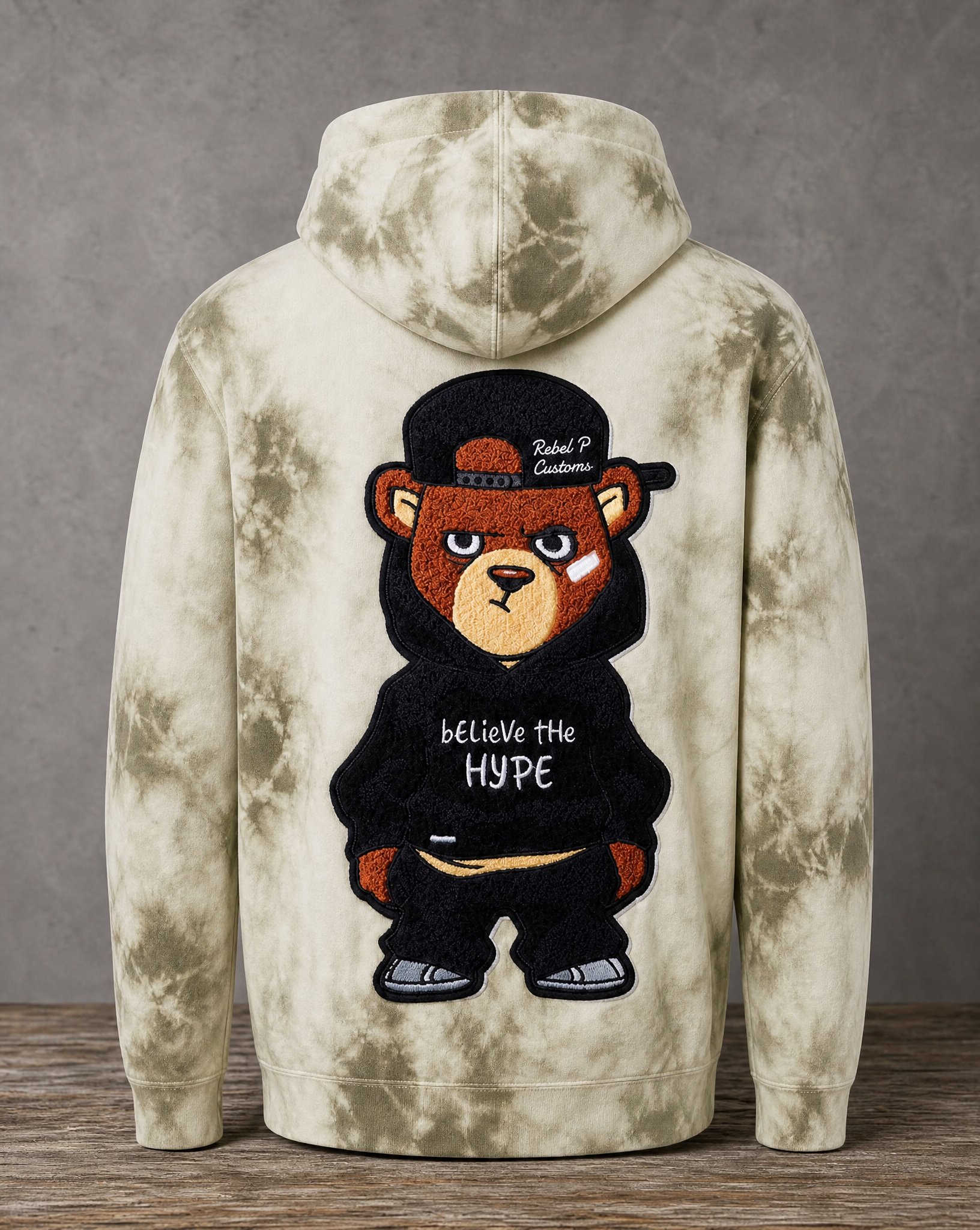 hoodie featuring a handcrafted chenille Believe the Hype patch