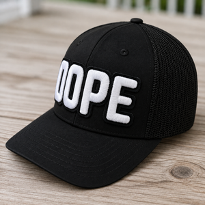 side view The Onyx Collection Glow in the Dark DOPE black hat with bold handcrafted lettering