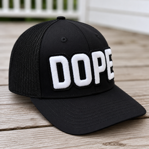 side view The Onyx Collection Glow in the Dark DOPE black hat with bold handcrafted lettering