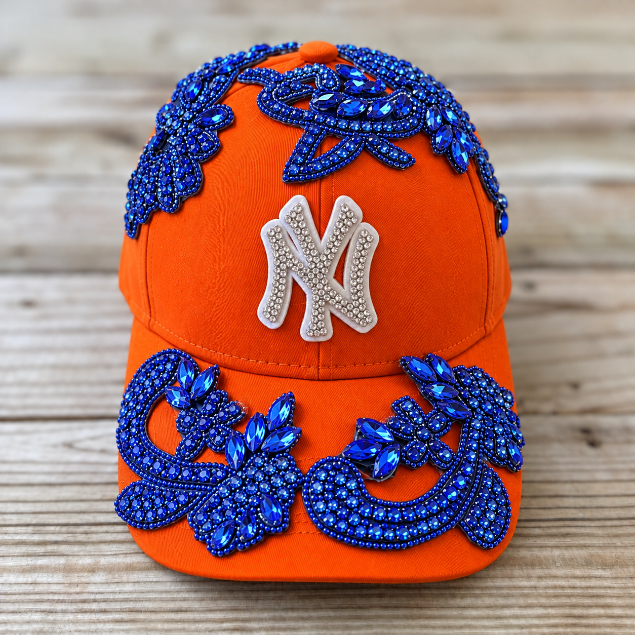 Blue Crystal Appliqué Orange New York Hat with hand-sewn blue crystal design
