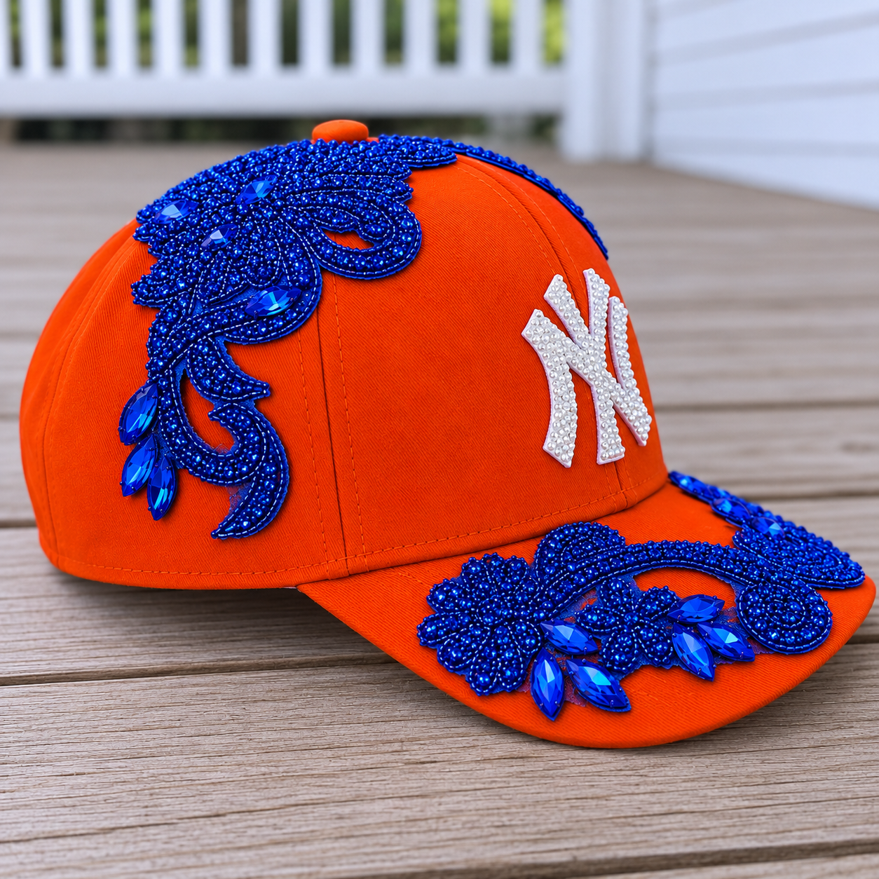 Left-side view of the Blue Crystal Appliqué Orange New York Hat