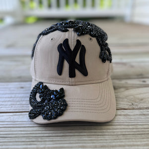 Front view of Black Crystal Appliqué Big New York Hat with hand-applied black crystals