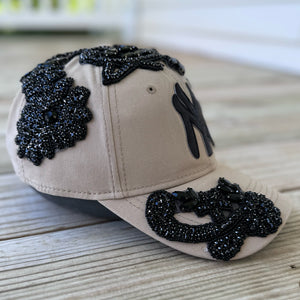 Left-side view of Black Crystal Appliqué Big New York Hat with hand-applied black crystals