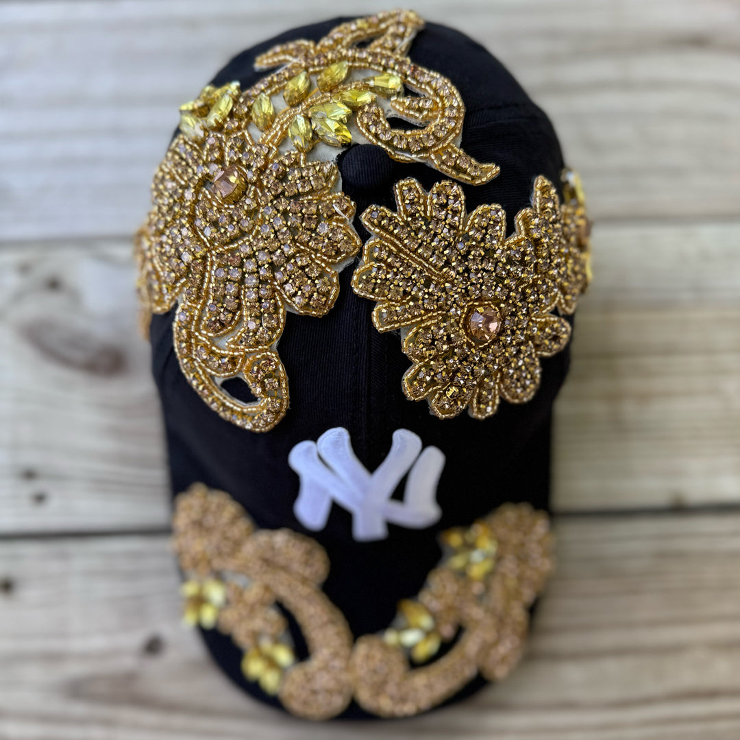 Top view of Gold Crystal Appliqué Black New York Hat with hand-applied gold crystals