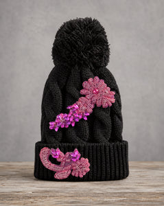 Pink crystal appliqué cable knit pom beanie with handcrafted crystal embellishments