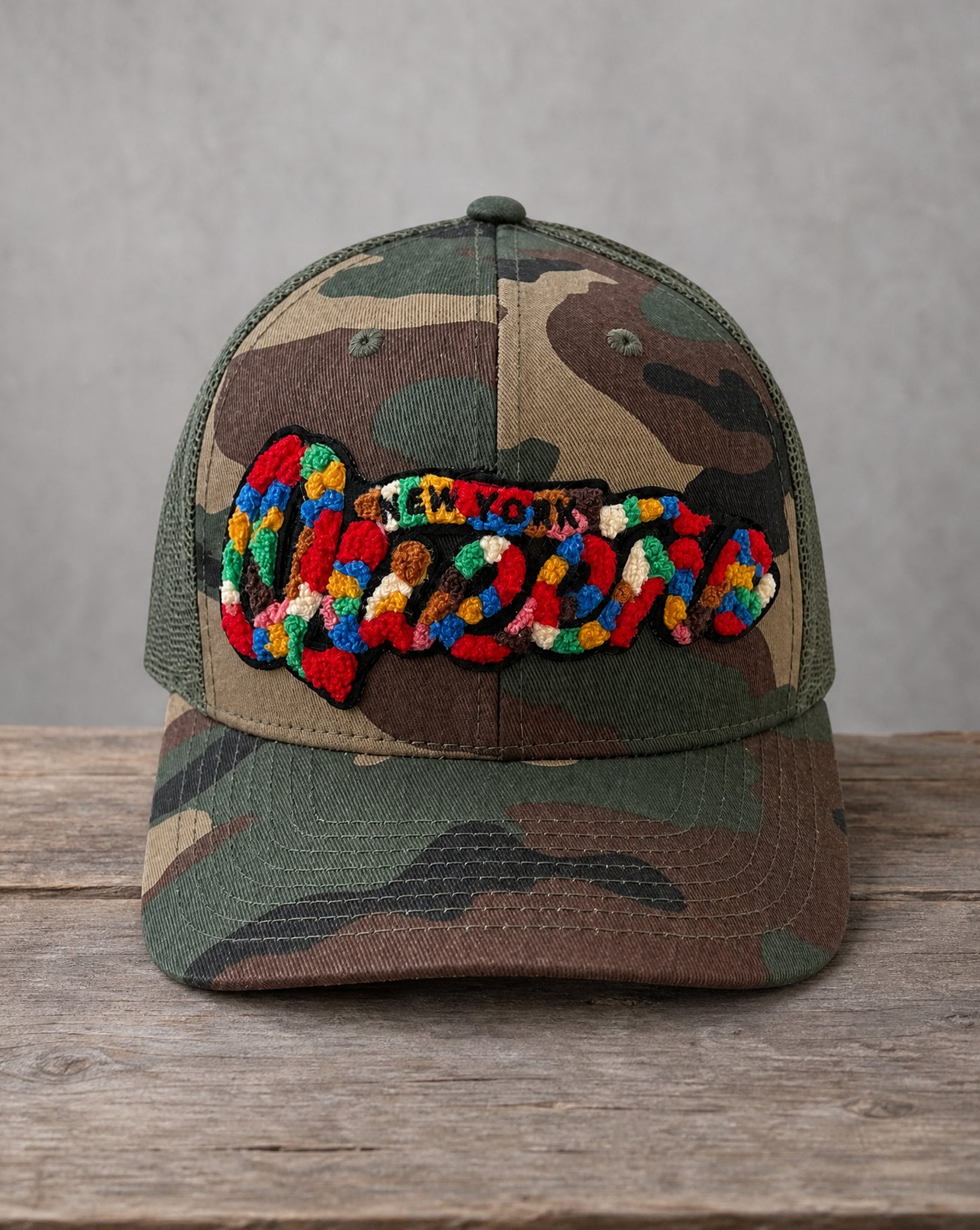 The City Collection Queens chenille camo hat with handcrafted chenille design