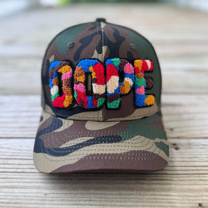 Colorful chenille DOPE patch on camouflage trucker hat - Rebel P Customs