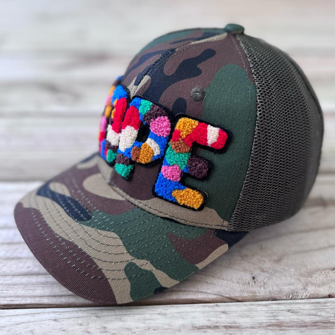 Right side view of camouflage trucker hat with colorful chenille DOPE patch and mesh back - Rebel P Customs