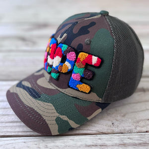 Right side view of camouflage trucker hat with colorful chenille DOPE patch and mesh back - Rebel P Customs