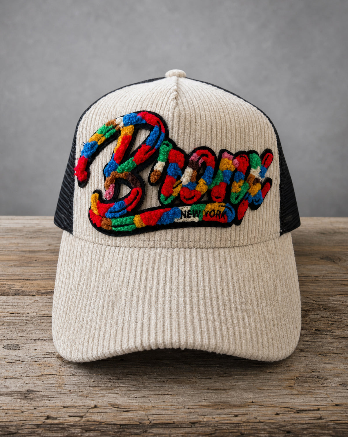 Bronx chenille corduroy trucker hat with handcrafted chenille design