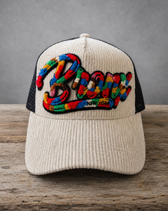 Bronx chenille corduroy trucker hat with handcrafted chenille design