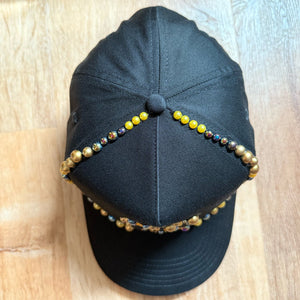 top view Black and gold pearl crystal appliqué New York hat with handcrafted embellishments