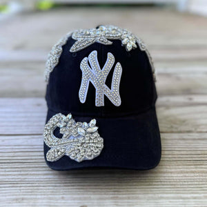 Front view of Silver Crystal Appliqué New York Hat with large statement crystal design