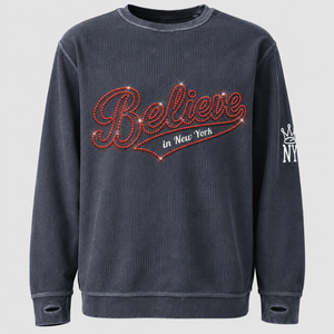Close-up mockup of red rhinestone detailing on the Believe In New York sweatshirt