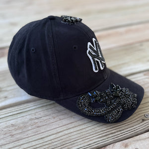 Left-side view of Black Crystal Appliqué Black New York Hat