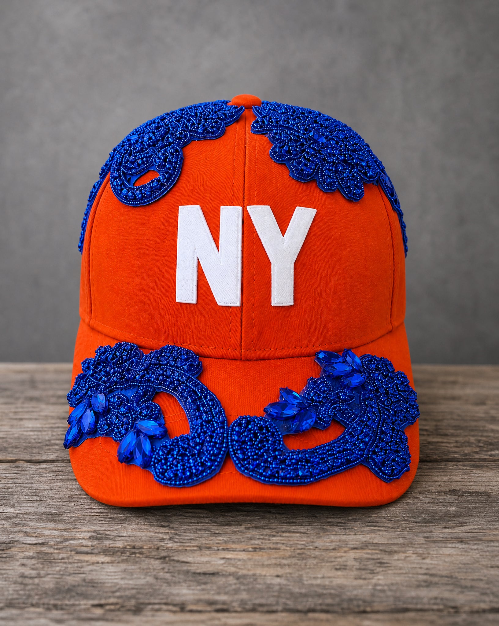 Blue Crystal Appliqué Orange New York Hat with hand-applied blue crystal design
