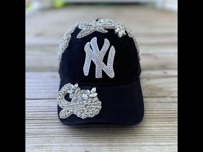 Video Front view of Silver Crystal Appliqué New York Hat with large statement crystal design