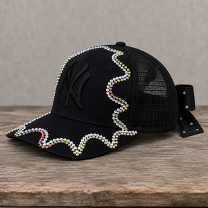 Side view of handcrafted black chameleon crystal appliqué New York hat