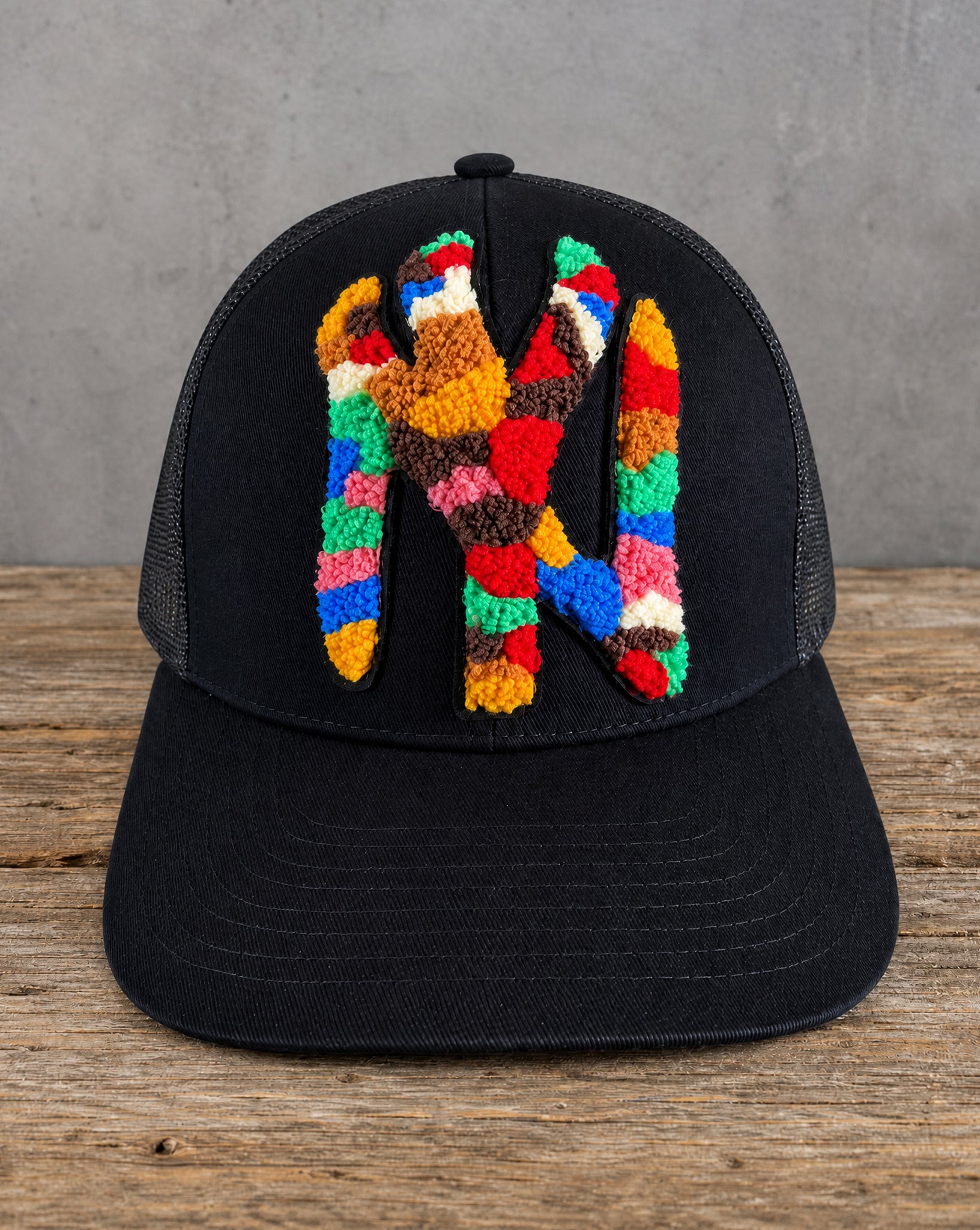 The Onyx Collection Statement NY Chenille Hat with oversized multicolor chenille NY patch on black cap