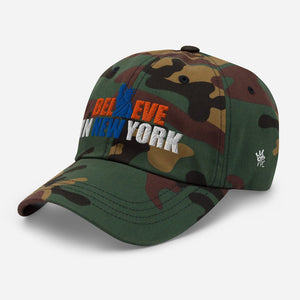 Right angel view of Believe in NYK camo trucker hat with orange and blue patches - Rebel P Customs